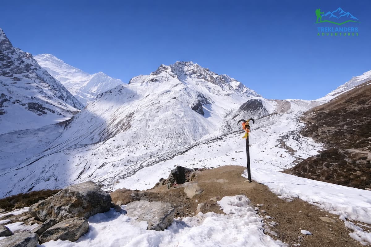 The pillar marking the trail crossing Larkya La Pass