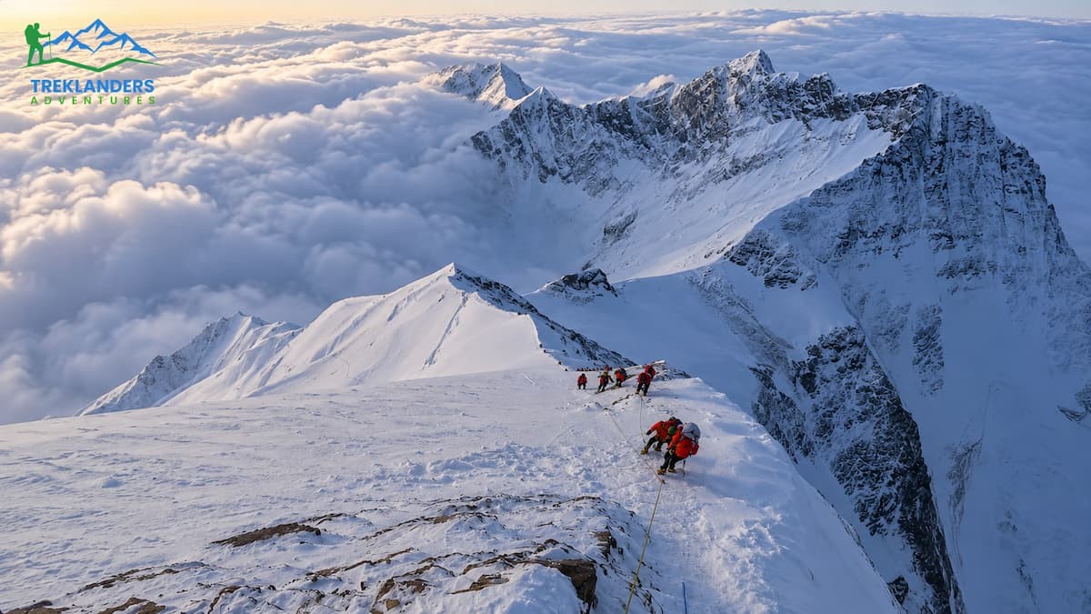 Climbers ascending the Everest summit with the support of Sherpas